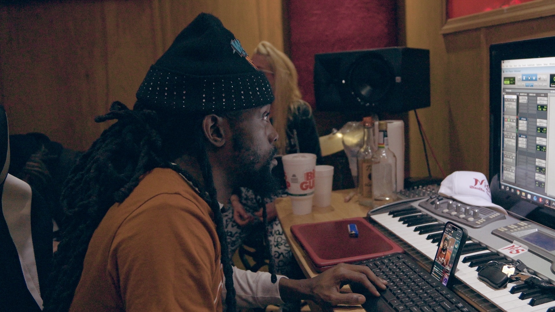 Bizz Da Collector working at the studio console