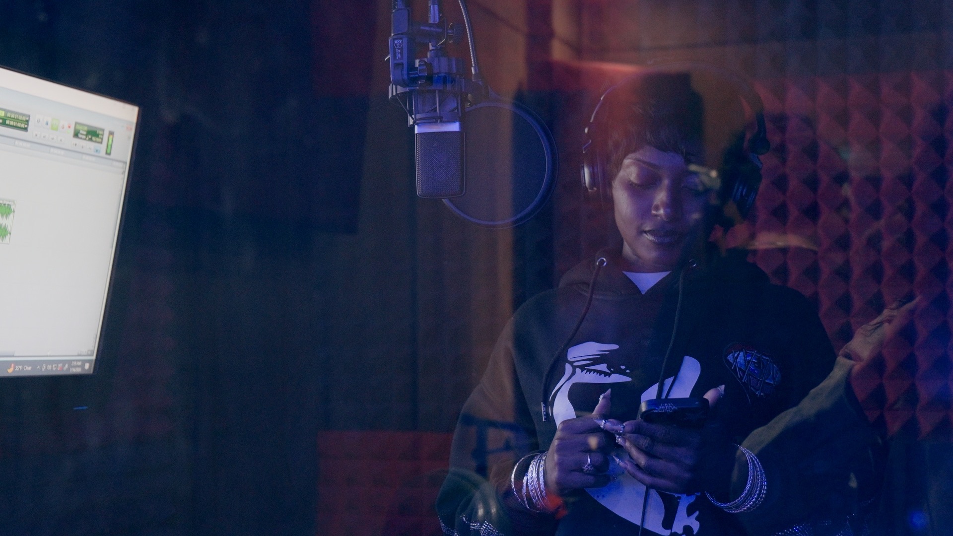 Artist inside the recording booth
